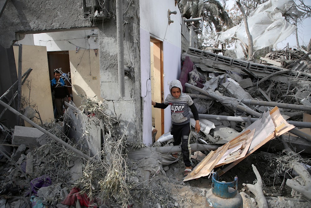 Palestinians inspect the ruins of a residential building destroyed by an Israeli airstrike in Rafah, southern Gaza Strip, Friday, March 29, 2024. (AP)