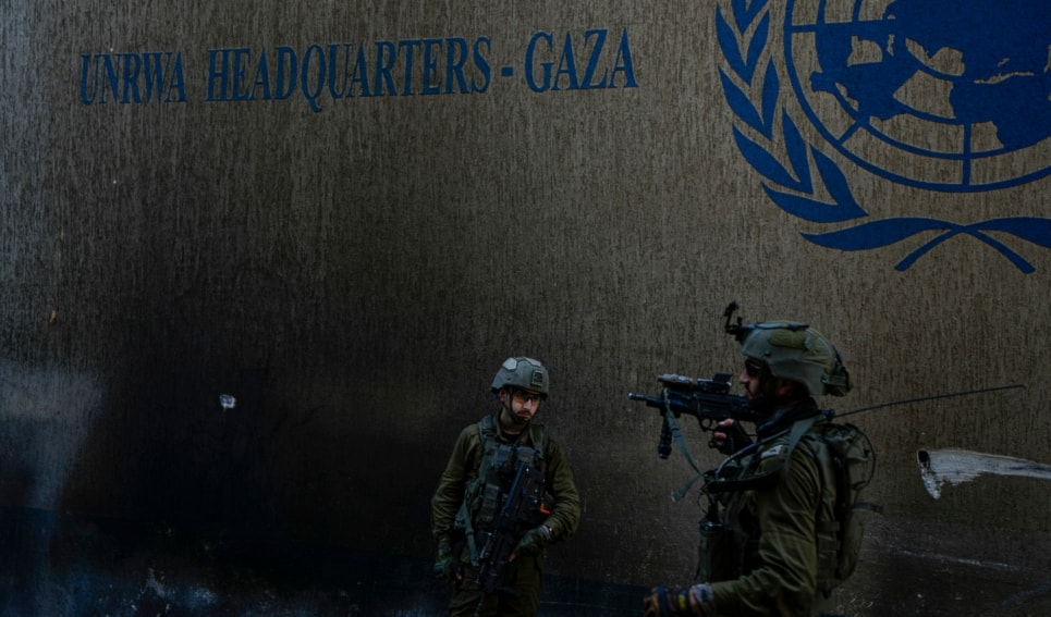 Israeli occupation forces take up position as they enter the UNRWA HQ, on Thursday, Feb. 8, 2024. (AP)