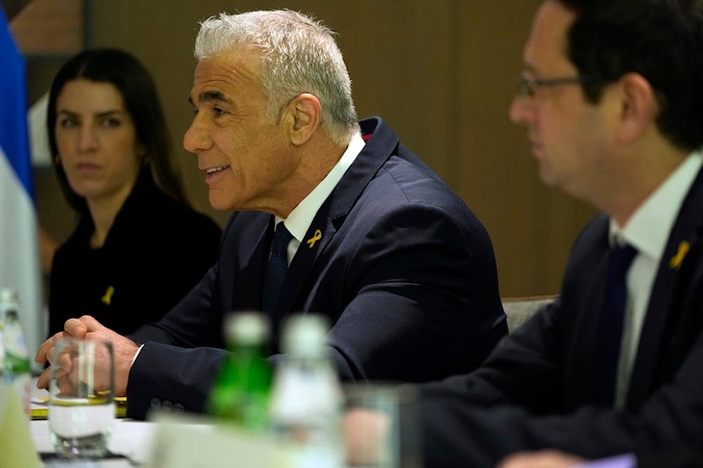 Israeli opposition leader Yair Lapid, meets with US Secretary of State Antony Blinken, not pictured, in 'Israel', Thursday, Feb. 8, 2024. (AP)