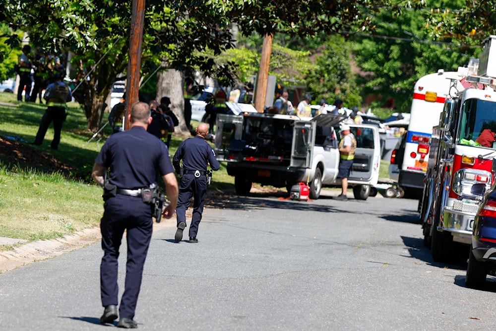 Charlotte Mecklenburg Police Department officers walk in the neighborhood where a shooting took place in Charlotte, N.C., Monday, April 29, 2024. (AP)