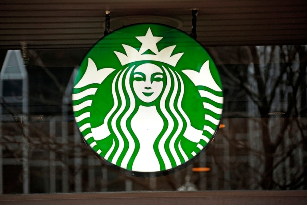 A file photo shows a Starbucks logo sign in the windows of one of the chain’s cafes in US. (AP)