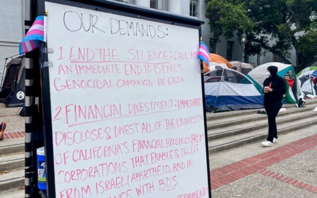 A sign is seen as pro-Palestinian protesters gather to demonstrate against Israeli genocide against Palestinians in Gaza, in front of Sproul Hall on the campus of the University of California, Berkeley, in Berkeley, California, April 23, 2024. (AP)