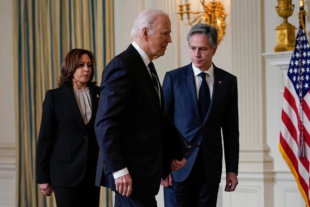 President Joe Biden leaves with Secretary of State Antony Blinken and Vice President Kamala Harris after speaking Tuesday, Oct. 10, 2023 (AP)