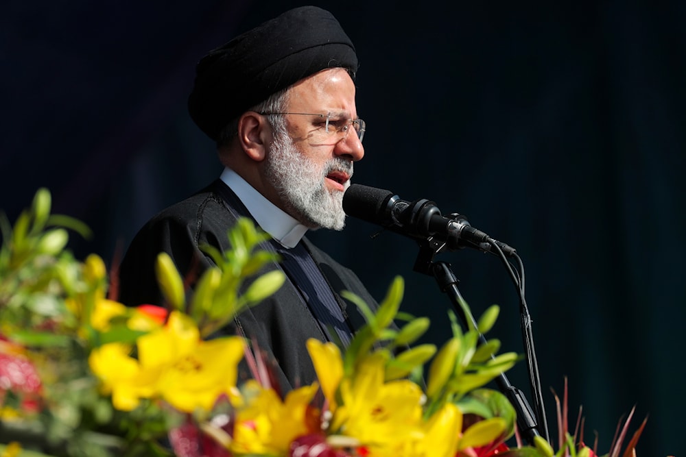 In this photo released by the Iranian Presidency Office, President Ebrahim Raisi addresses the crowd in the annual rally commemorating Iran's 1979 Islamic Revolution in Tehran, Iran, February 11, 2024 (AP)