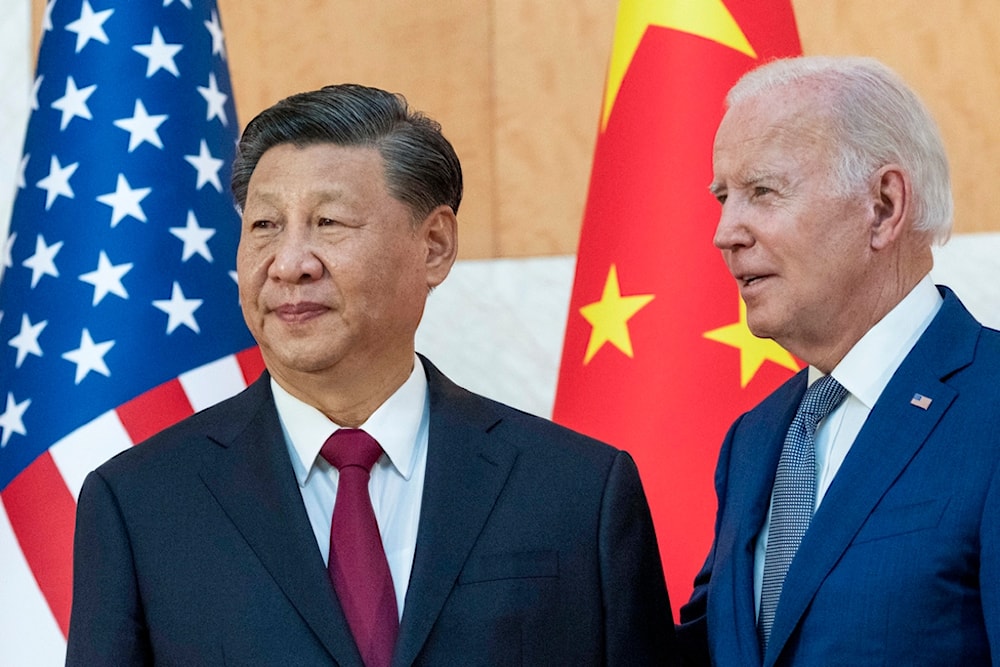 President Joe Biden, right, stands with Chinese President Xi Jinping before a meeting on the sidelines of the G20 summit meeting, Nov. 14, 2022 (AP)