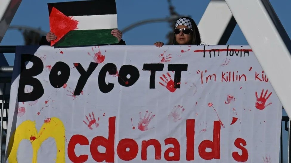 An anti-McDonald's banner held in a pro-Palestine rally (Social Media)