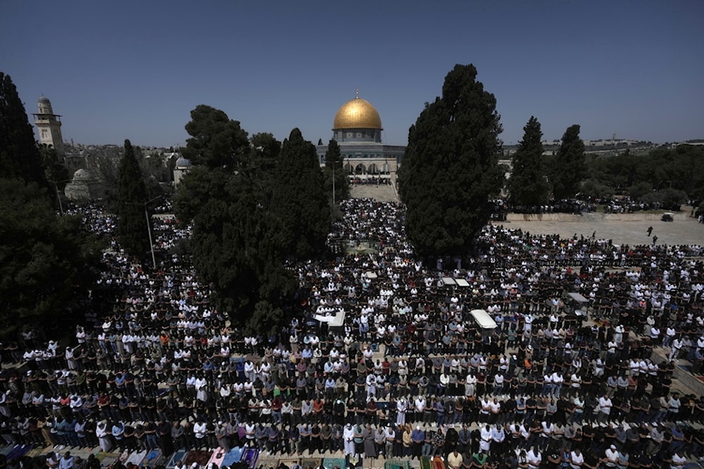 Muslim worshippers at the Al-Aqsa Mosque compound take part in the last Friday prayers of the holy month of Ramadan, in the Old City of al-Quds, Friday, April 5, 2024. (AP)
