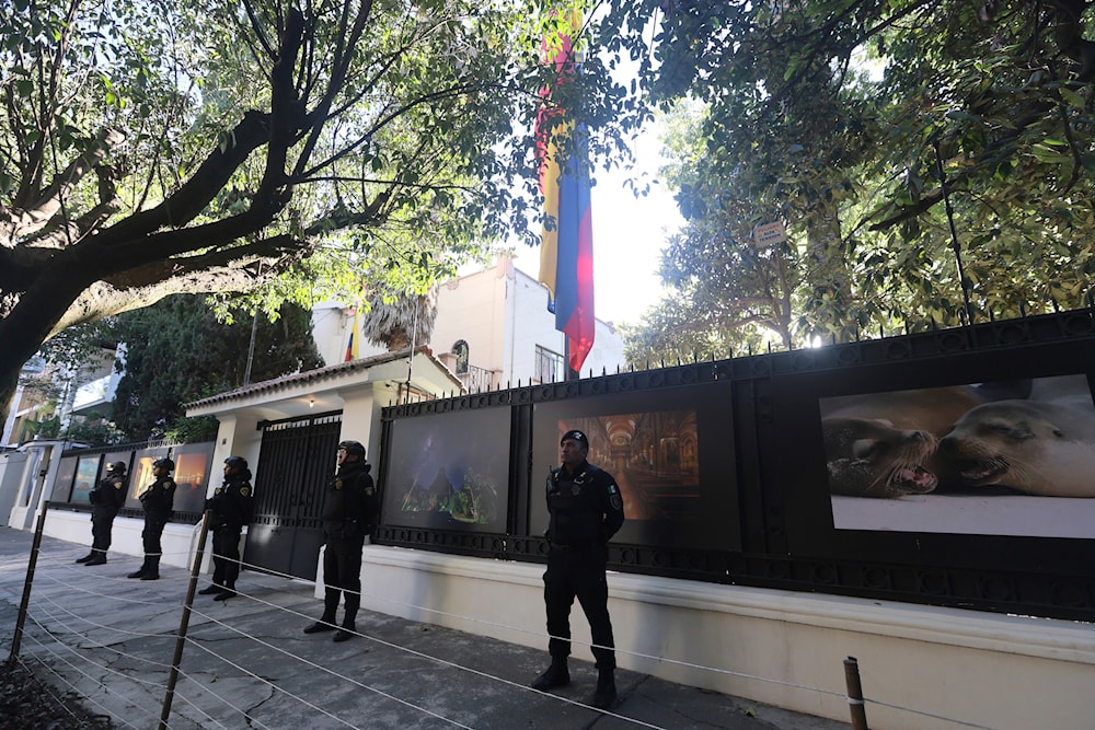 Mexican police stand guard outside the Ecuadorian Embassy, in Mexico City, Saturday, April 6, 2024. (AP)