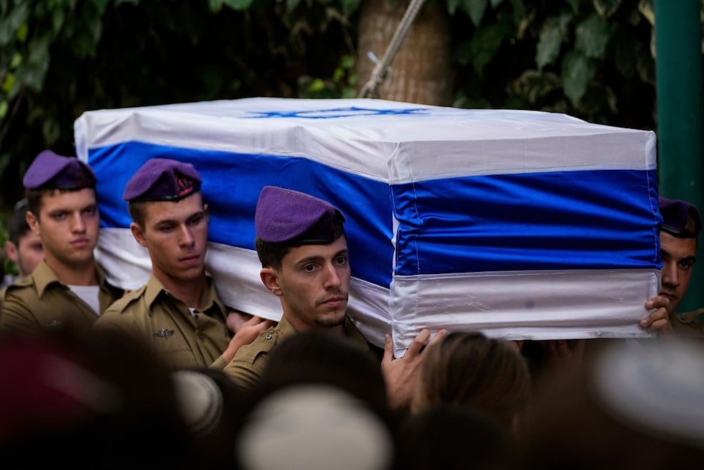 sraeli soldiers carry the flag-draped casket of Staff Sgt. Lavi Lipshitz during his funeral in the Mount Herzl Military Cemetery in Jerusalem, Wednesday, Nov. 1, 2023. (AP