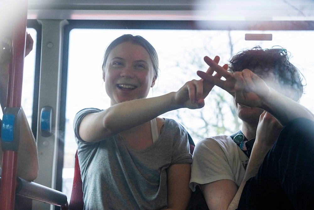 Climate activist Greta Thunberg after being detained in a bus for joining protestors during a climate protest near the Dutch parliament in The Hague, Netherlands, Saturday, April 6, 2024. (AP)