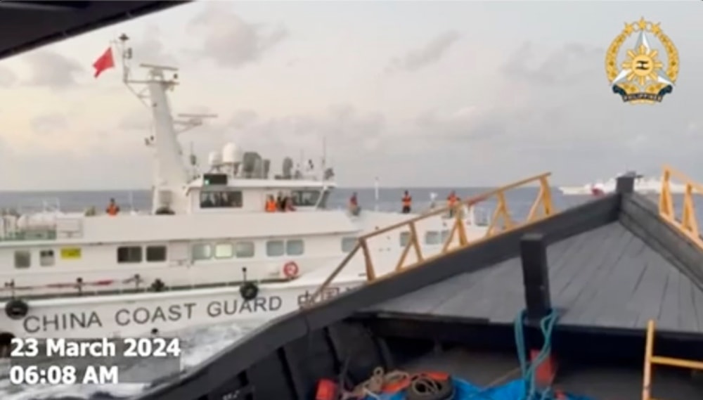 Taken from a video by the Armed Forces of the Philippines, a Chinese Coast Guard ship blocks the Philippine ship in the South China Sea , on March 23, 2024. (Armed Forces of the Philippines/AP)