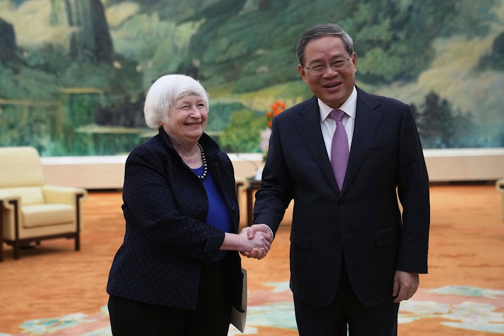 US Treasury Secretary Janet Yellen shakes hands with Chinese Premier Li Qiang at the Great Hall of the People in Beijing on April 7, 2024, as Yellen begins two days of high-level talks in Beijing. (AFP)