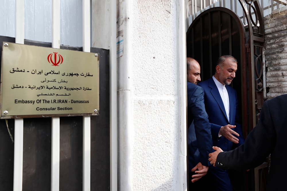 Iranian Foreign Minister Hossein Amirabdollahian, right, leaves after the opening of the new Iranian consulate building in Damascus, Syria, April 8, 2024 (AP)