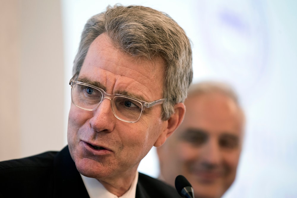 Former US Ambassador to Greece Geoffrey Pyatt, right, speaks to reporters about an upcoming trade fair, in Athens, on Thursday, July 12, 2018. (AP)