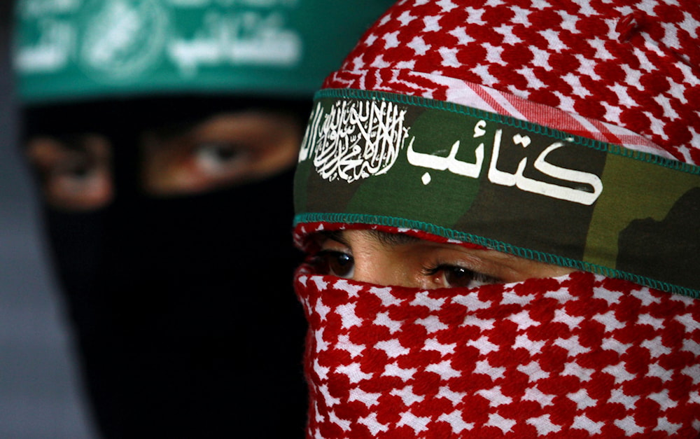 Masked Palestinian Hamas militants hold a press conference in Gaza City, Saturday, April 9, 2011.