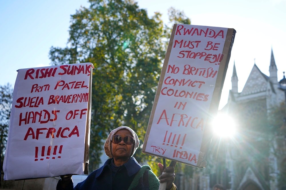 A protester stands outside the Supreme Court in London, on November 15, 2023. (AP)