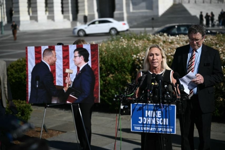 Marjorie Taylor Greene (2nd R) and Thomas Massie (R) hold a press conference outside the US Capitol. (AFP via Getty Images)