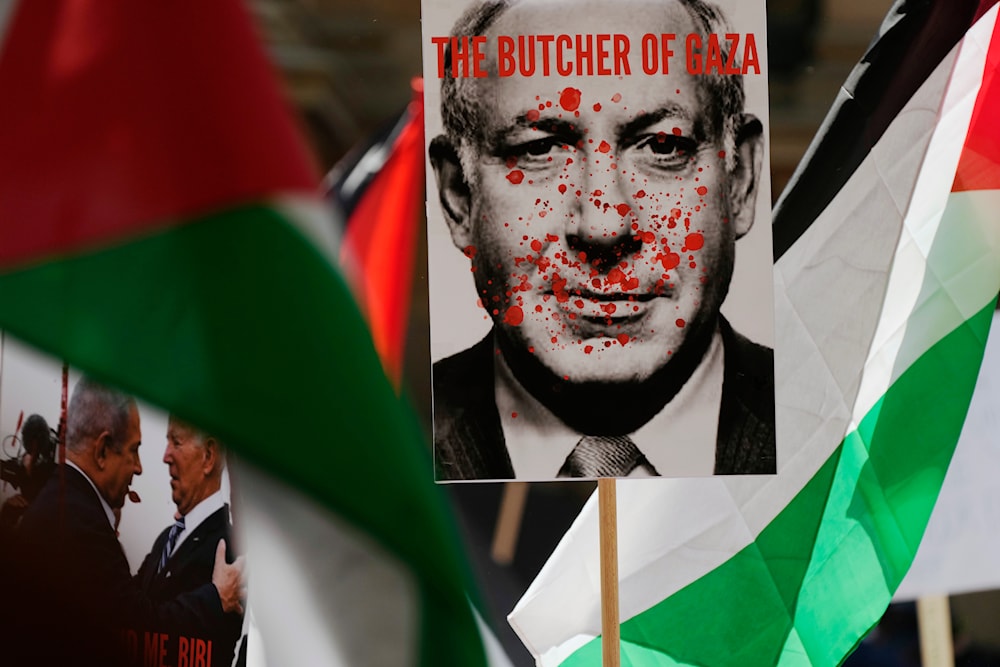 Israel's Prime Minister Benjamin Netanyahu carried among Palestinian flags during a pro-Palestinian rally in Sydney, Saturday, Oct. 21, 2023. (AP)