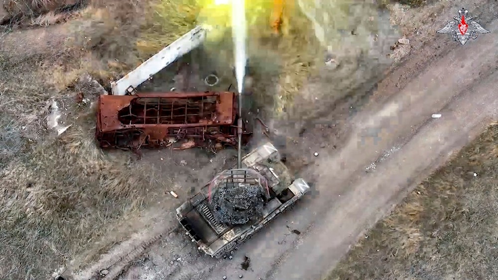 In this photo taken from video and released by the Russian Defense Ministry Press Service on Monday, April 8, 2024, a Russian tank fires towards an Ukrainian position in an undisclosed location (Russian Defense Ministry Press Service via AP)