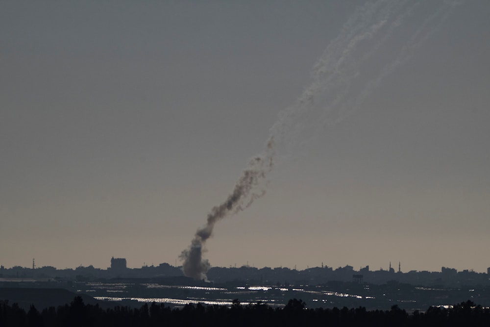 Trails of rockets fired towards occupied Palestine from the Gaza Strip, as seen from southern occupied Palestine, May 7, 2024 (AP)