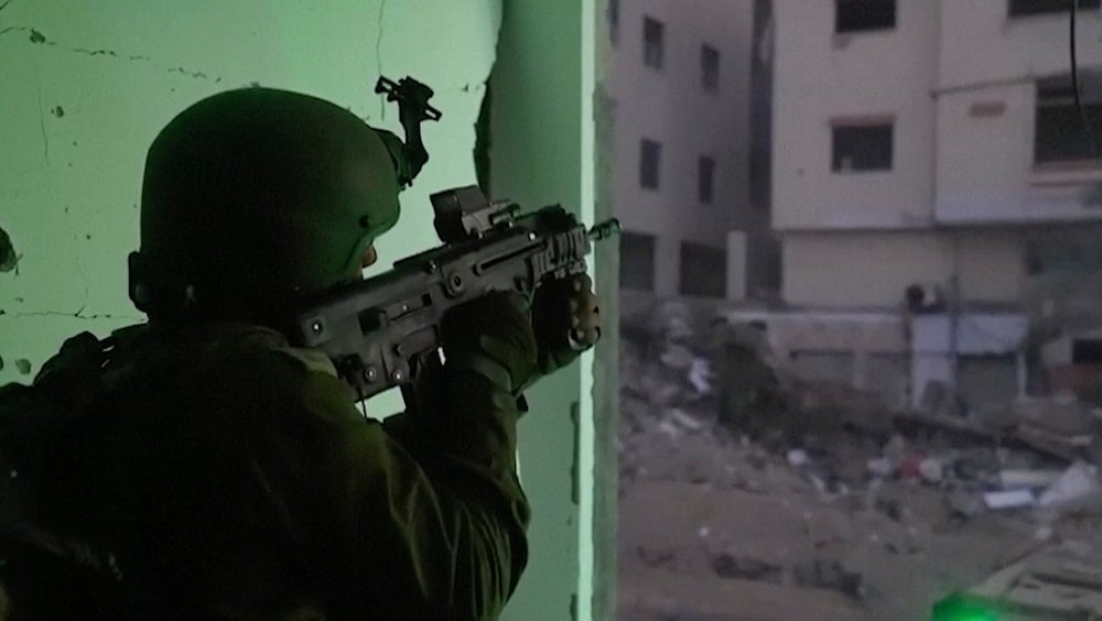 In this image taken from a video released by the Israeli Occupation Forces on Tuesday, Nov. 14, 2023, an Israeli occupation soldier shoots Palestinians in Gaza City, Palestine. (AP)