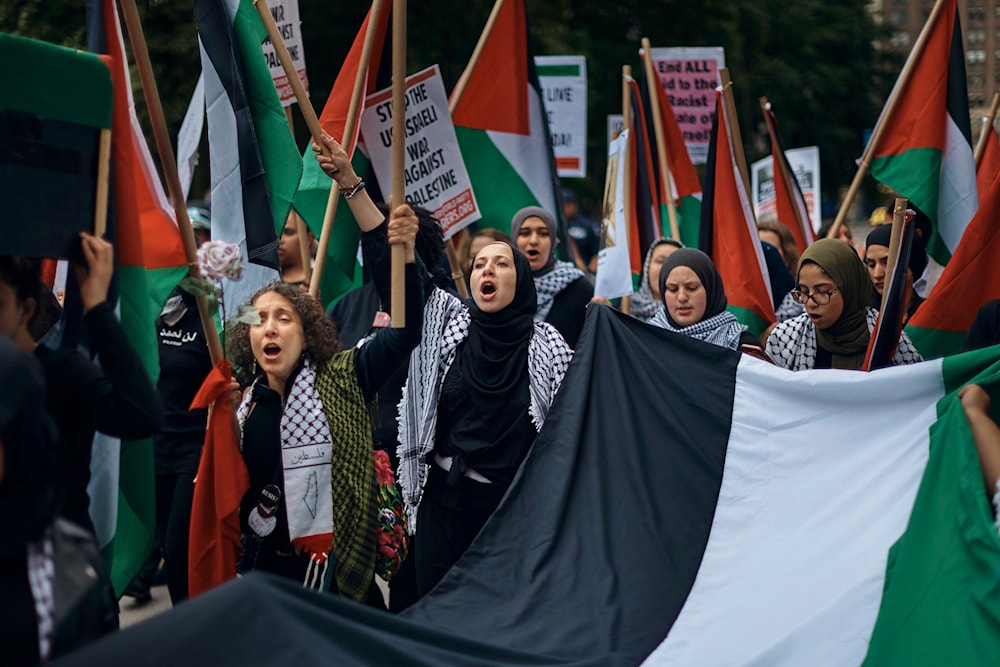 Palestinian supporters shout slogans as they protest against Israel during the annual Celebrate 