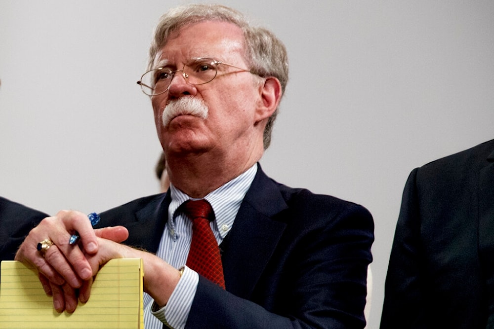 Then-National Security Adviser John Bolton attends a meeting with former President Donald Trump at the G-7 summit in Biarritz, France, Aug. 26, 2019. (AP)