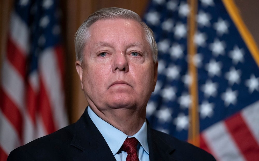 Senator Lindsey Graham waits to speak to reporters at the US Capitol in Washington, DC, on February 10, 2022. (AP)