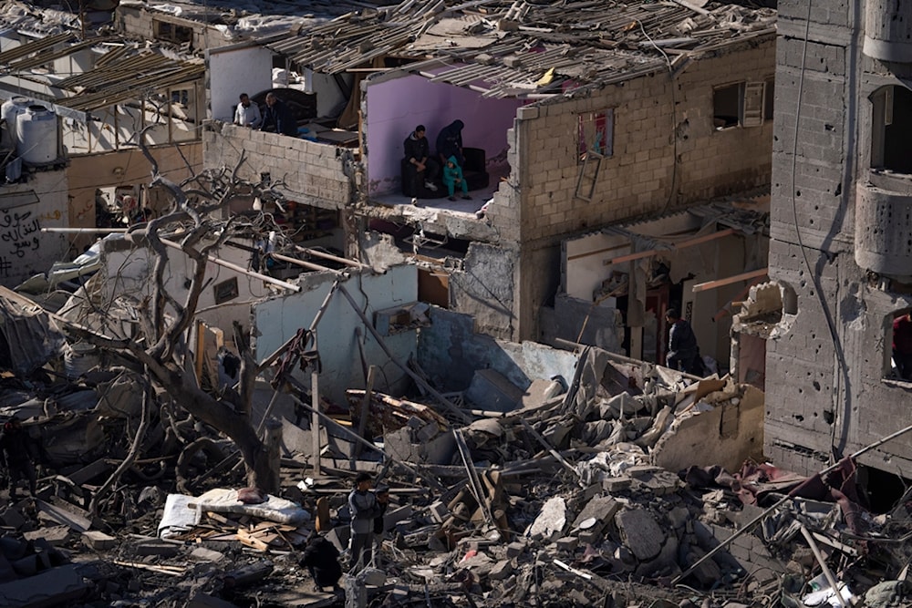 Palestinians look at the destruction after an Israeli strike on residential buildings and a mosque in Rafah, Gaza Strip, Feb. 22, 2024. (AP)