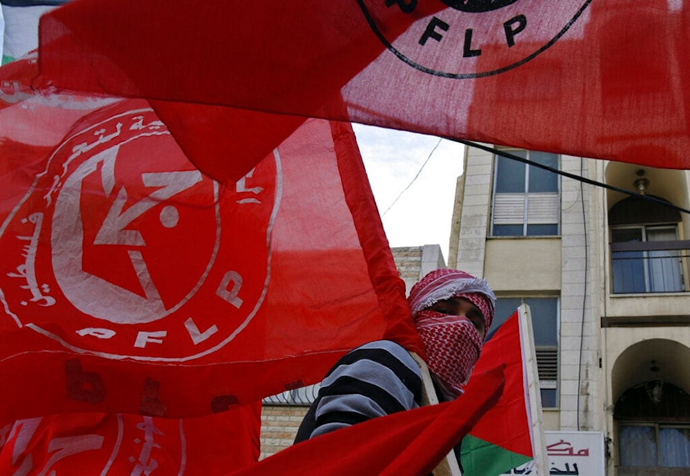 Palestinian youth participates in a rally marking the 42nd anniversary of the leftist Popular Front for the Liberation of Palestine (PFLP), Nablus, West Bank, Palestine, Dec. 19, 2009. (AP)