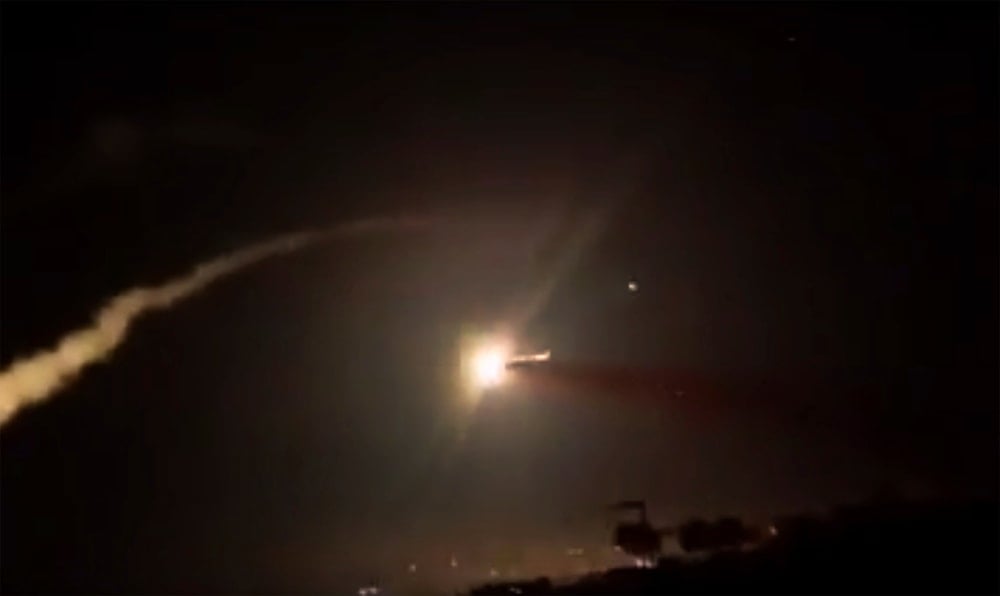 This frame grab from a video provided by the Syrian official news agency SANA shows missiles flying into the sky near Damascus, Syria, December 25, 2018 (SANA)