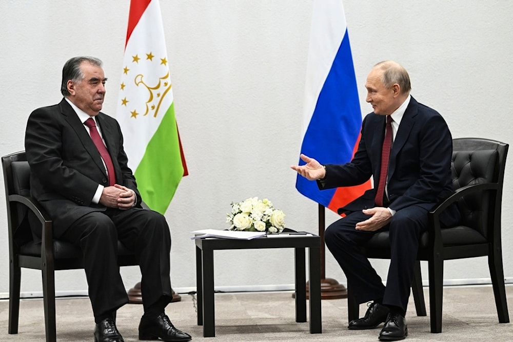 Russian President Vladimir Putin, right, gestures as he speaks to Tajikistan President Emomali Rahmon during their talks in Kazan the capital of Republic of Tatarstan, Russia, Wednesday, Feb. 21, 2024. (AP)