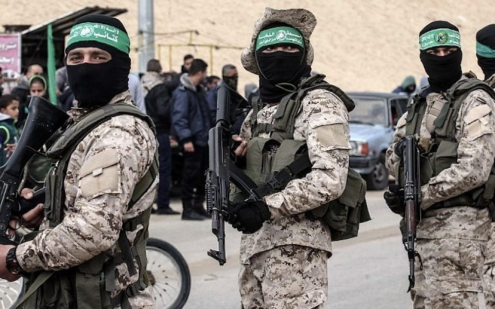 Members of the Izz ad-Din al-Qassam Brigades, the Hamas military wing, attend a memorial for Mohamed Zouari in the southern Gaza Strip town of Rafah on January 31, 2017, (AFP)