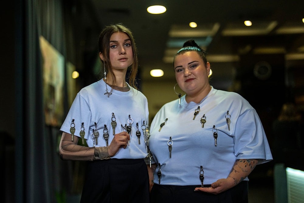 Ukrainian singer Jerry Heil, left, and rapper alyona alyona pose for a photograph during an interview with The Associated Press in Ukraine, Thursday, April 25, 2024. (AP)