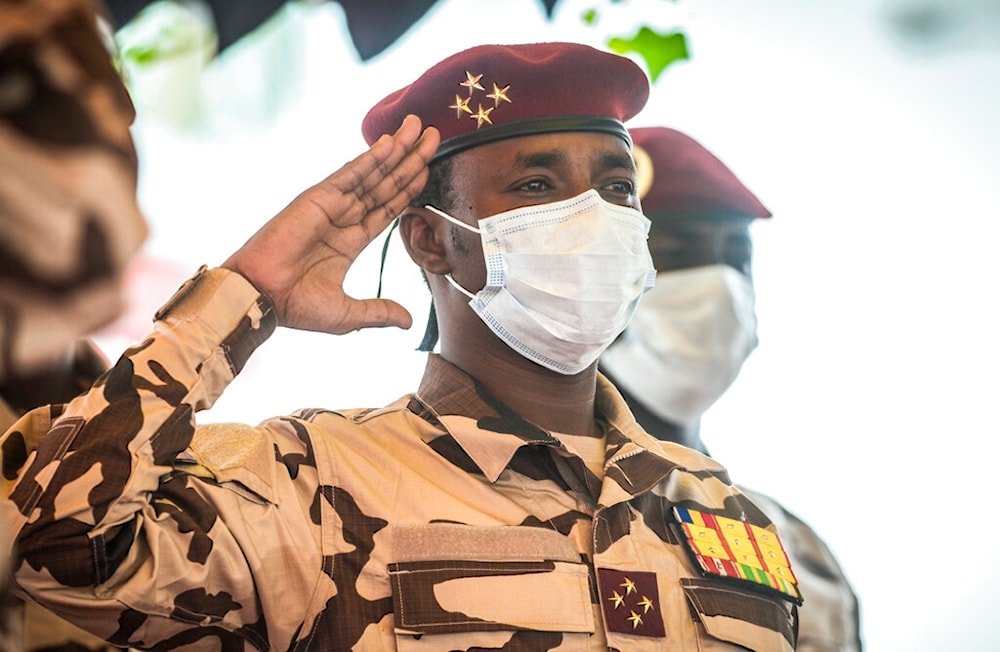 SMahamat Idriss Deby, head of the Transitional Military Council (CMT) salutes the coffin of the late Chadian president Idriss Deby during the state funeral in N'Djamena, Chad, Friday, April 23, 2021. (AP)