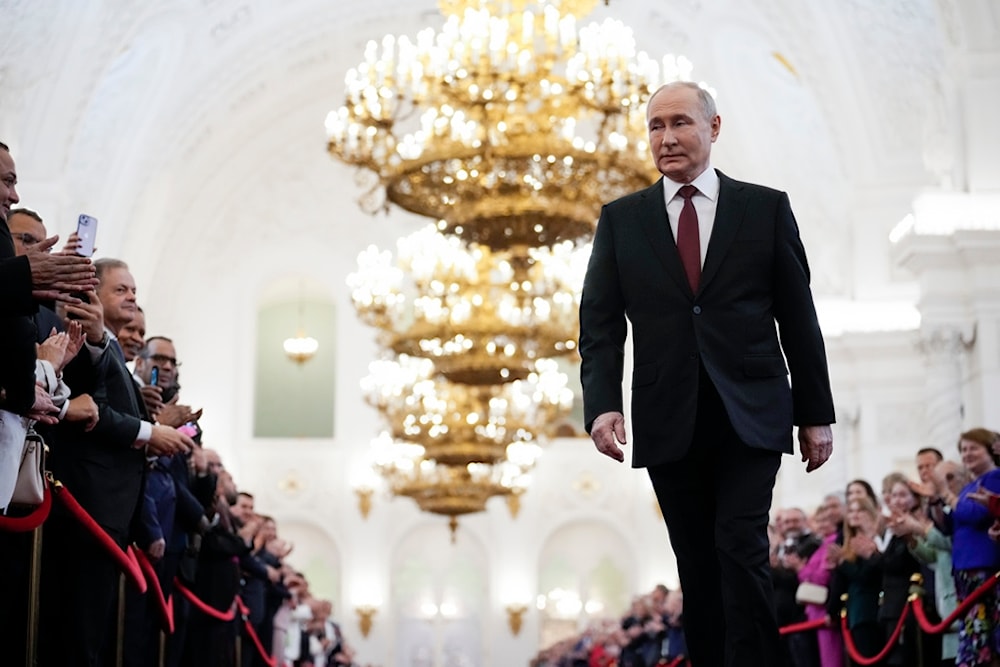 Vladimir Putin walks to take his oath as Russian president during an inauguration ceremony in the Grand Kremlin Palace in Moscow, Russia, Tuesday, May 7, 2024. (AP)