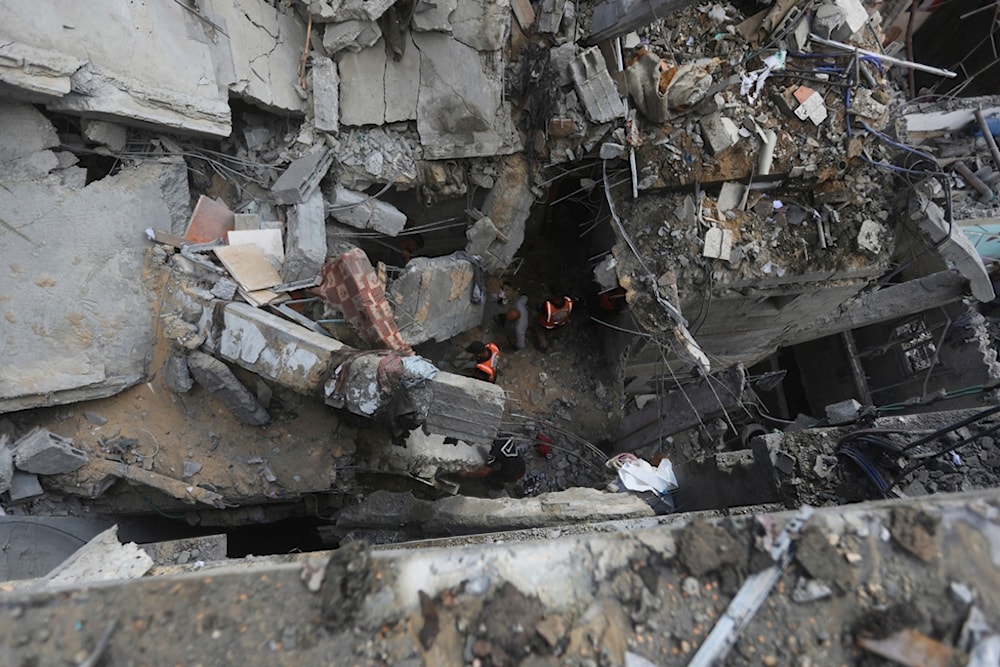 Palestinians look at the destruction after an Israeli strike on residential building in Rafah, Gaza Strip, Palestine, May 7, 2024. (AP)