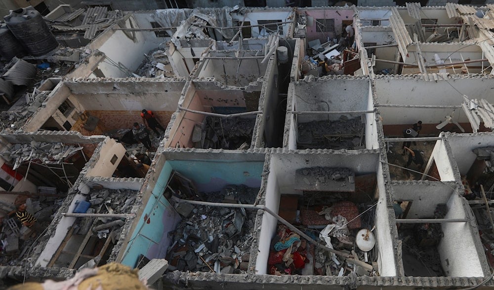 Palestinians look at the destruction after an Israeli strike on residential building in Rafah, Gaza Strip, Tuesday, May 7, 2024. (AP)