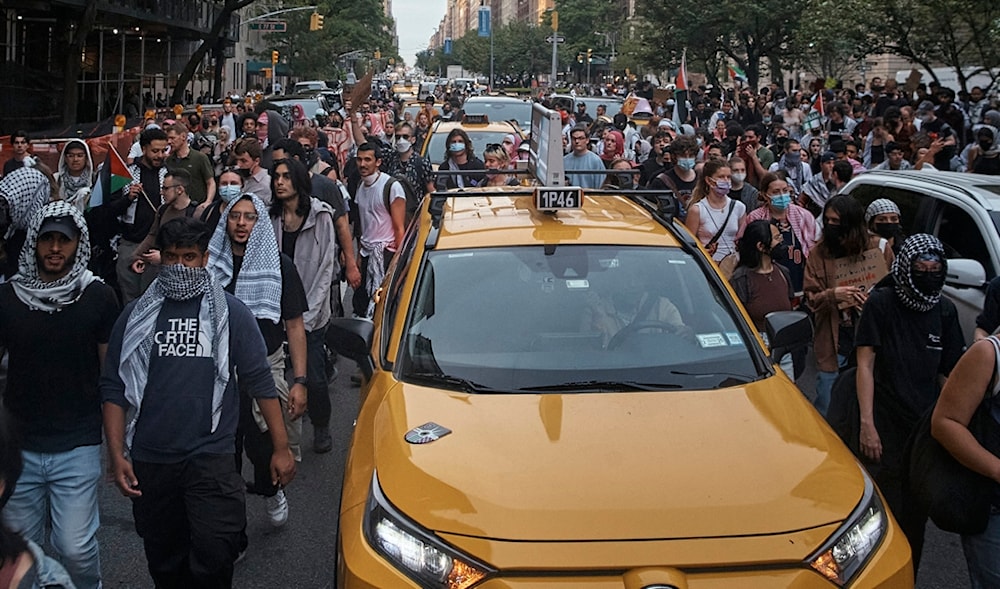 Pro-Palestinian protesters march in between traffic near the Metropolitan Museum of Art, where the Met Gala takes place, Monday, May 6, 2024, in New York. (AP)