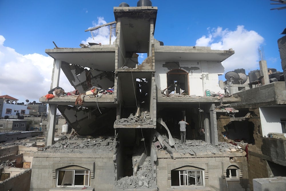 Palestinians look at the destruction by an Israeli strike on a residential building in Rafah, Gaza Strip, Tuesday, May 7, 2024. (AP)