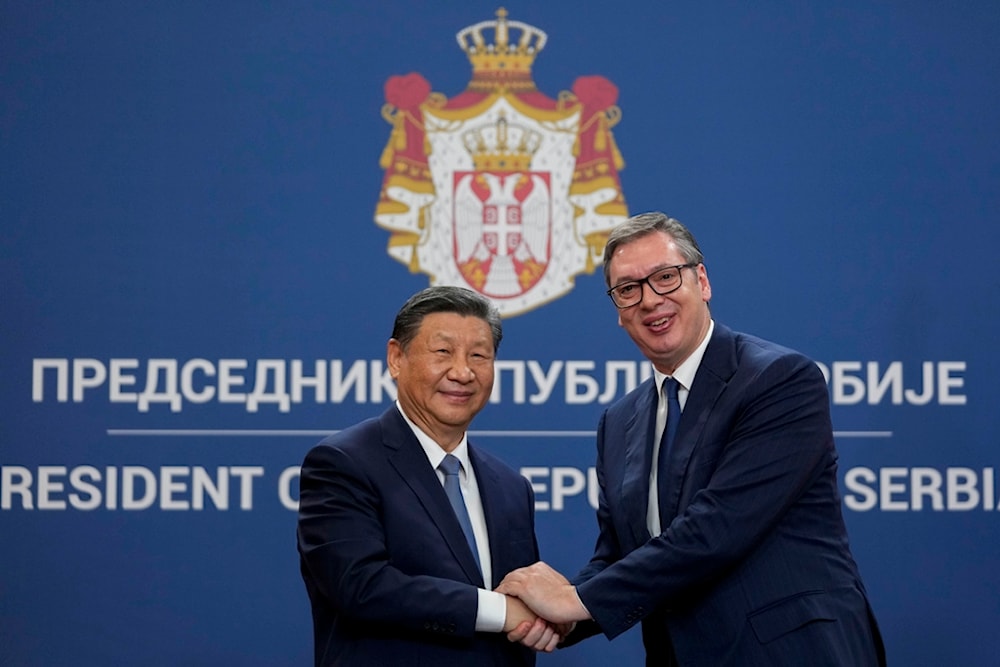 Chinese President Xi Jinping shakes hands with Serbian President Aleksandar Vucic at the Serbia Palace in Belgrade, Serbia, Wednesday, May 8, 2024. (AP Photo/Darko Vojinovic)