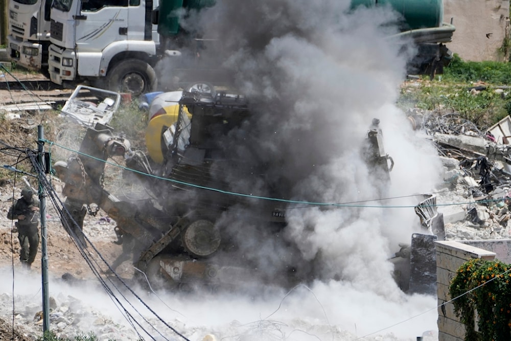 Some lowing an explosions raises as Israeli occupation soldiers take cover during a military operation in Deir al-Ghusun, near the West Bank town of Tulkarem, Palestine, May 4, 2024. (AP)
