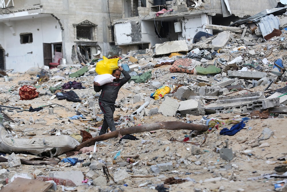 A Palestinian walks through the destruction left by the Israeli offensive on Khan Younis, Gaza Strip, Friday, March 8, 2024.(AP)