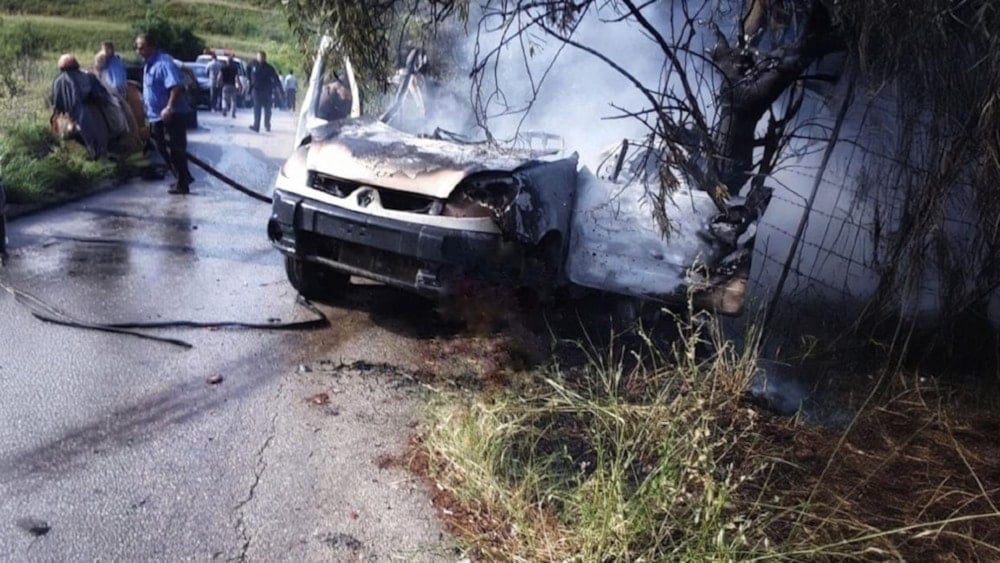 The vehicle targeted by the Israeli occupation airstrike on the Bafliyeh - Sour road in southern Lebanon. (Social media)