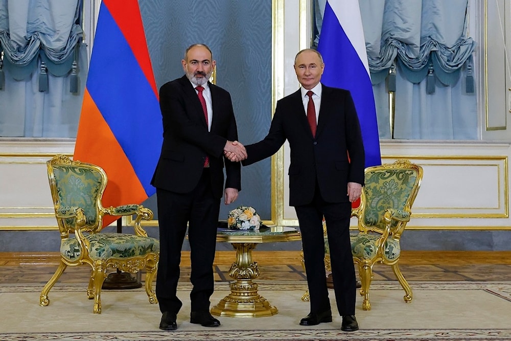Russian President Vladimir Putin, right, and Armenian Prime Minister Nikol Pashinyan shake hands prior to their talks on the sidelines of a meeting of the Eurasian Economic Union at the Kremlin in Moscow, Russia, on Wednesday, May 8, 2024.(AP)