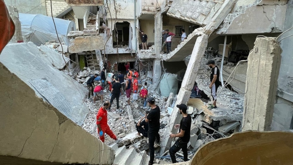 Rescue teams assess the damage following an Israeli airstrike on the Ain al-Helweh camp in Saida- October 1, 2024 (AFP).