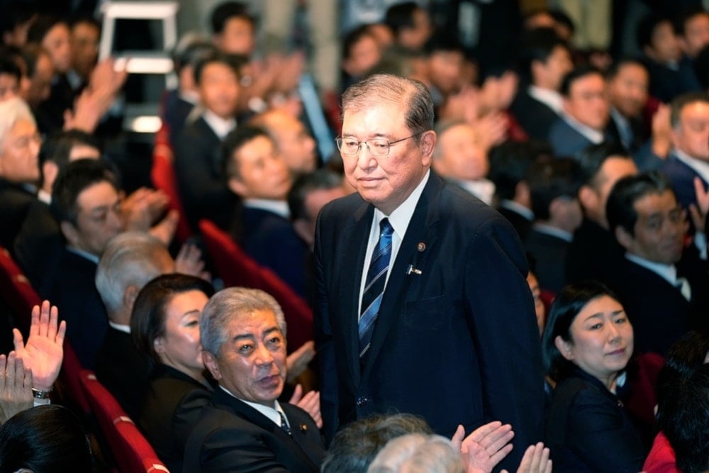  Shigeru Ishiba, center, acknowleges after he was elected as new head of Japan's ruling Liberal Democractic Party (LDP) during the party's leadership election on September 27,2024, in Tokyo.   (AP)