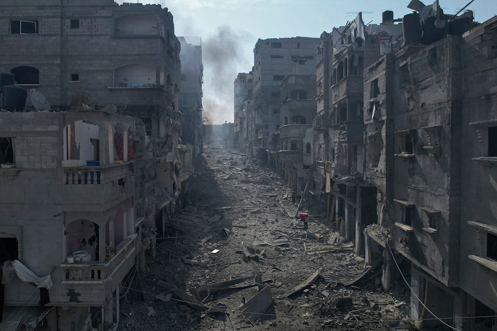 A view of the rubble of buildings hit by an Israeli airstrike, in Jabalia, Gaza strip, on October 11, 2023. (AP)