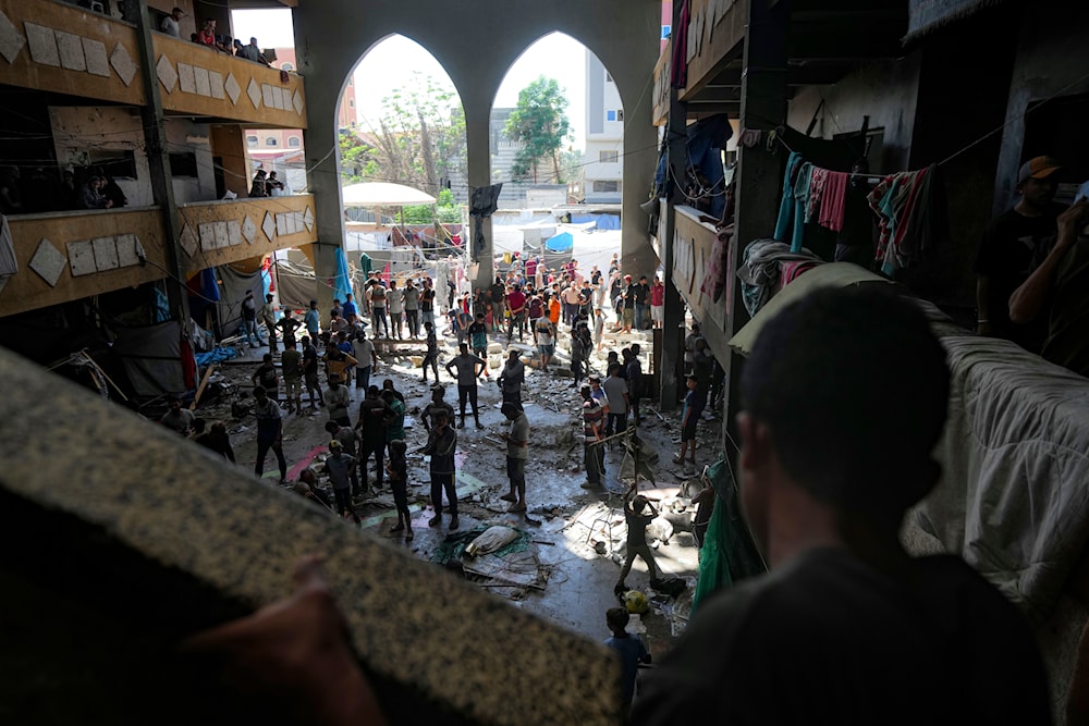 Palestinians inspect the damage of a school hit by an Israeli bombardment on Deir al-Balah, central Gaza Strip, on October 10, 2024. (AP)