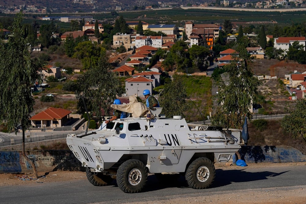 U.N. peacekeepers patrol on the Lebanese side of the Lebanese-Israeli border in the southern village of Kfar Kila, with the Israeli town of Metula in the background, Lebanon, Friday, Oct. 13, 2023. (AP)